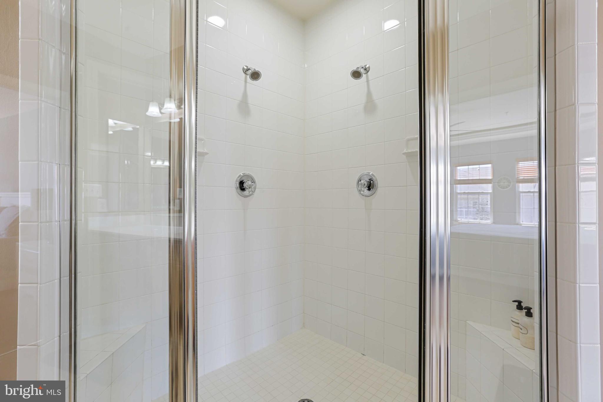 7209 Darby Downs, Unit 7209 Elkridge, MD 21075 - Photo 13 of 19 a bathroom with a glass shower door