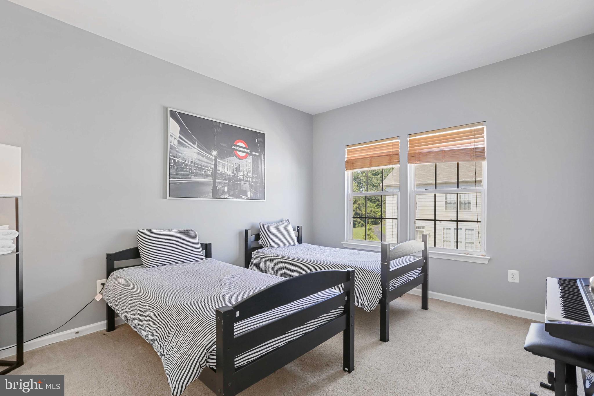 7209 Darby Downs, Unit 7209 Elkridge, MD 21075 - Photo 15 of 19 a bedroom with a bed and a window