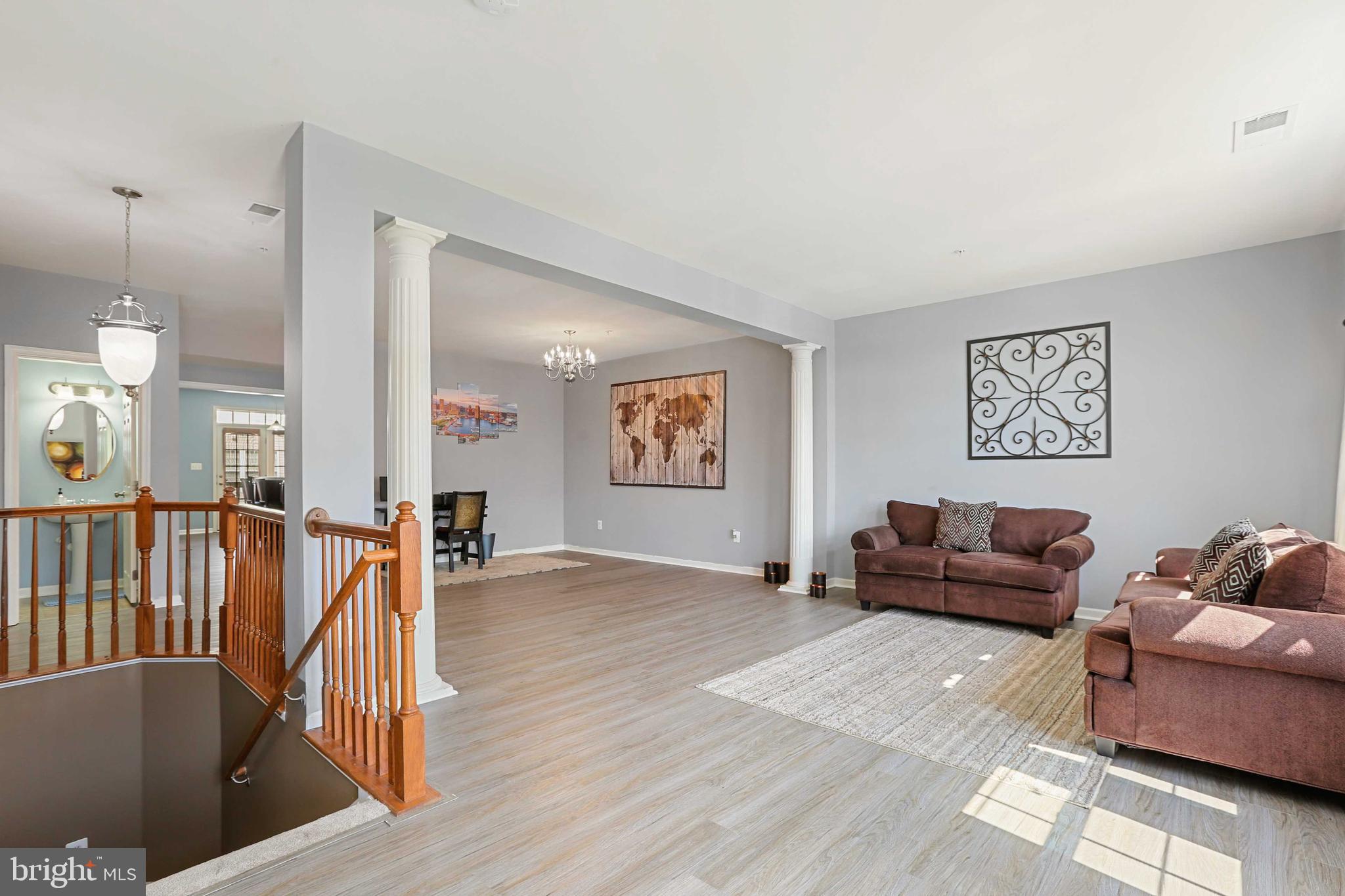 7209 Darby Downs, Unit 7209 Elkridge, MD 21075 - Photo 19 of 19 a living room with furniture and a wooden floor