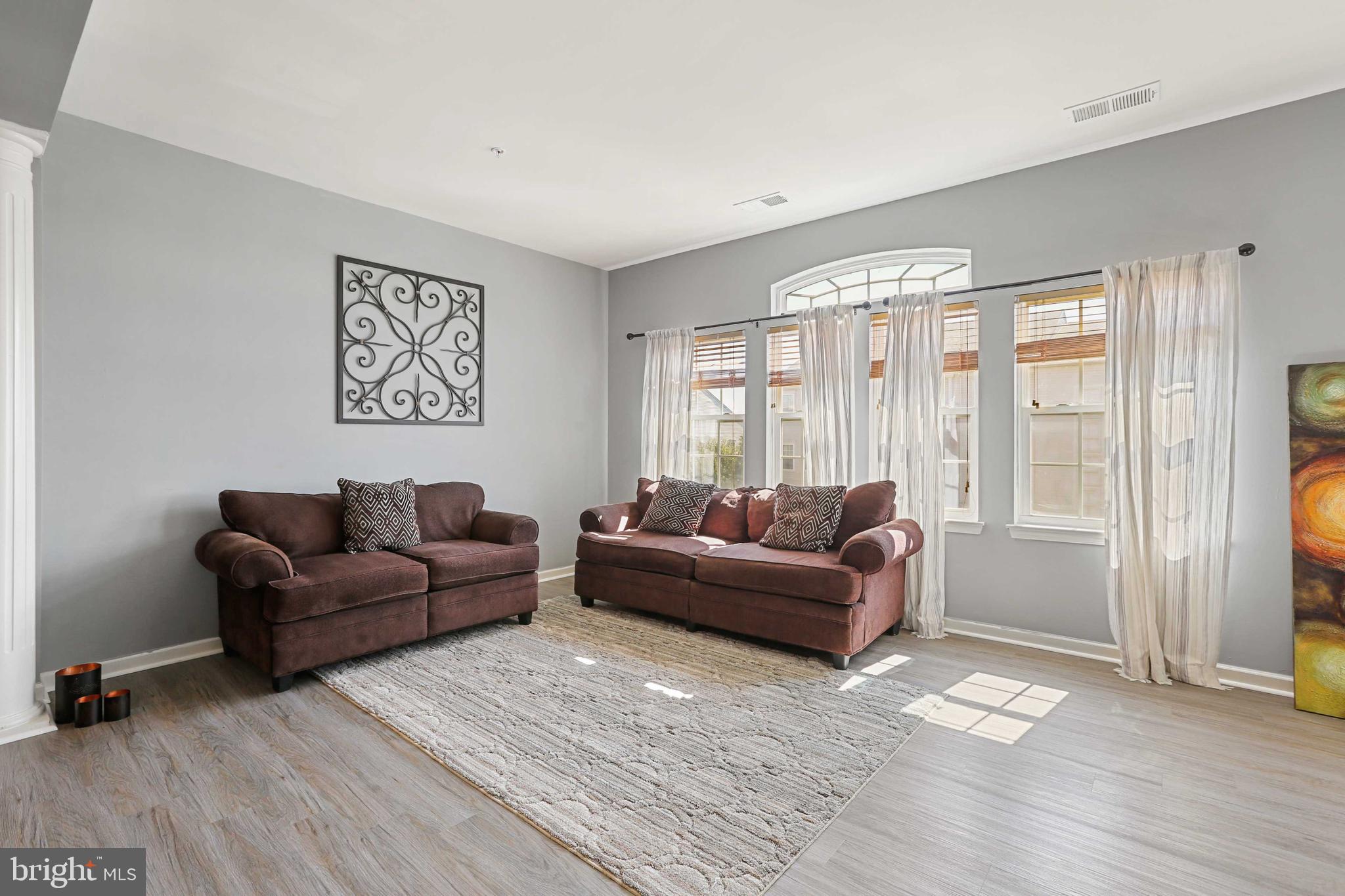7209 Darby Downs, Unit 7209 Elkridge, MD 21075 - Photo 2 of 19 a living room with furniture and a window