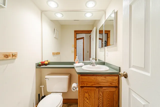 a bed room with a bed and a chandelier