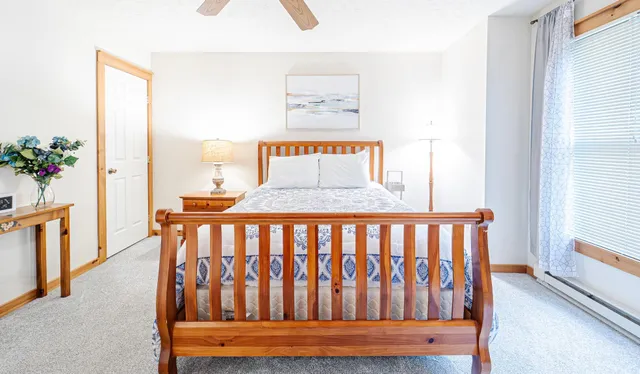 a bedroom with furniture and a window