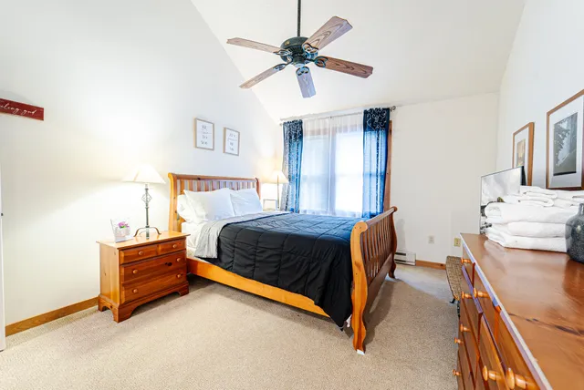 a bedroom with a bed and a dresser