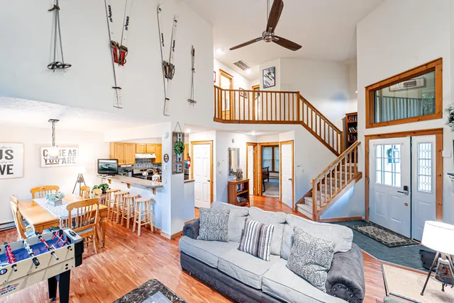a living room with furniture a rug and a fireplace
