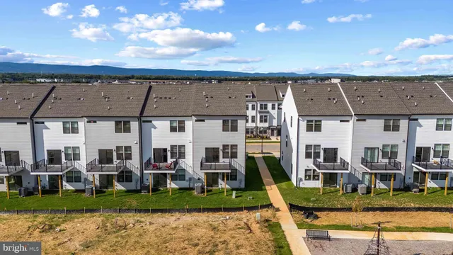 front view of a building with a garden