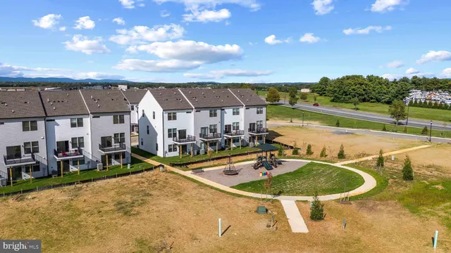 a swimming pool with outdoor seating and yard