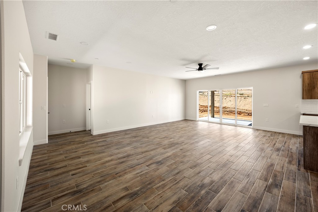 22324 Rancho Street Apple Valley, CA 92308 - Photo 12 of 47 wooden floor in an empty room with a window
