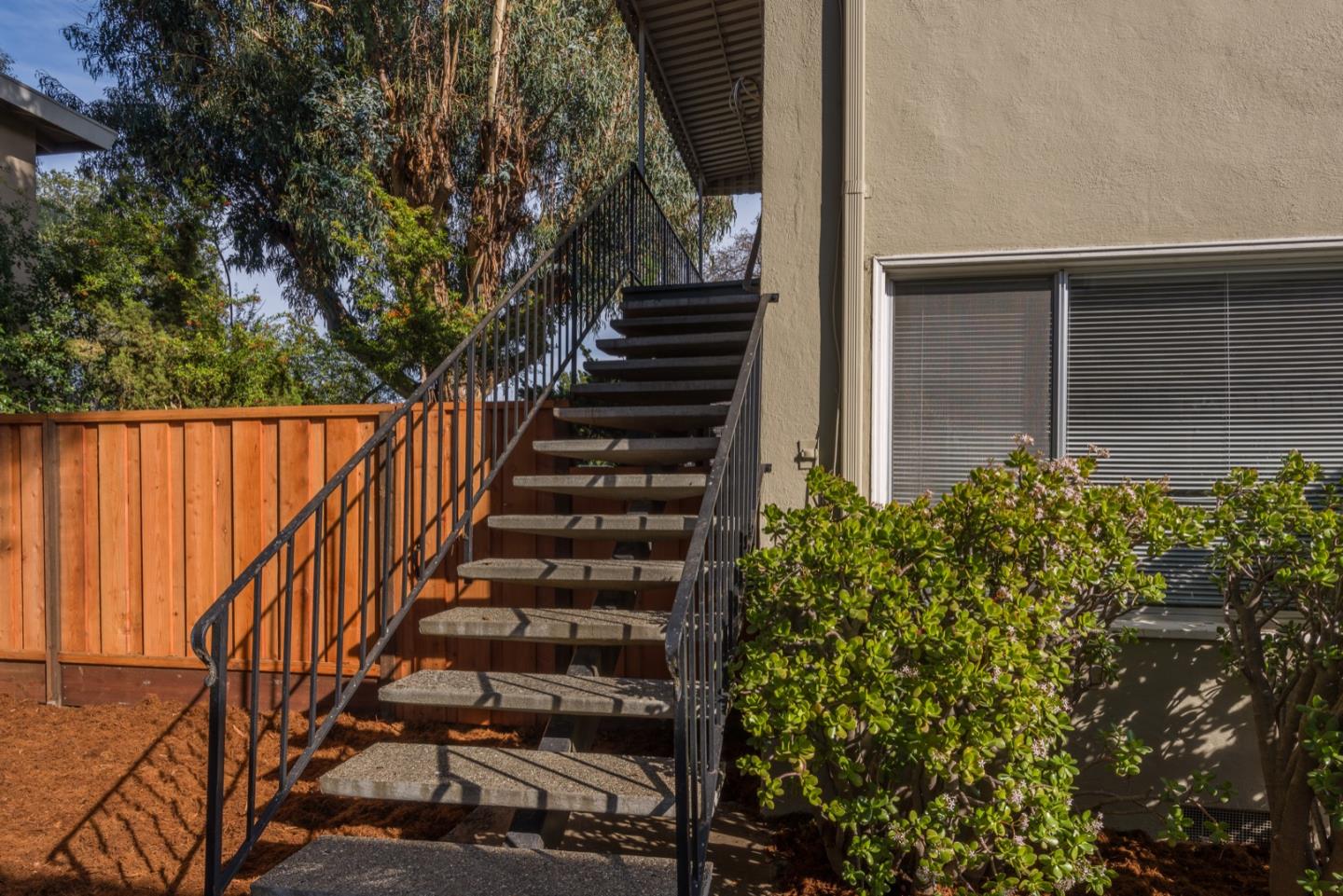 882 Middle Avenue Menlo Park, CA 94025 - Photo 12 of 22 a view of a pathway of a house with wooden fence