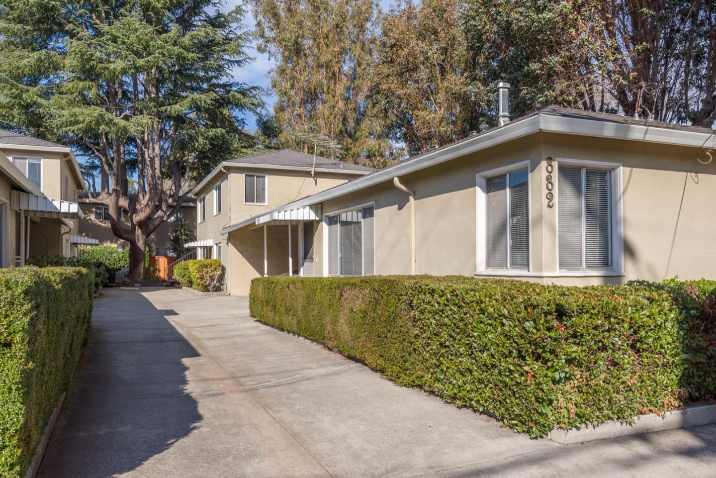 882 Middle Avenue Menlo Park, CA 94025 - Photo 3 of 22 a front view of a house with a garden