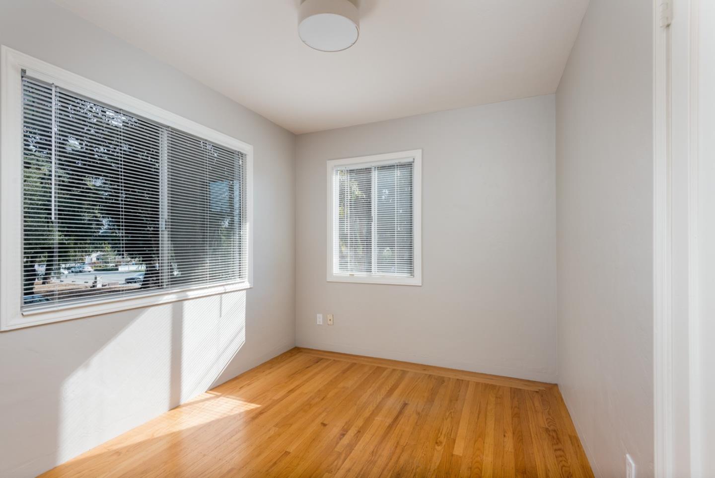 882 Middle Avenue Menlo Park, CA 94025 - Photo 8 of 22 a view of a livingroom with wooden floor and a window