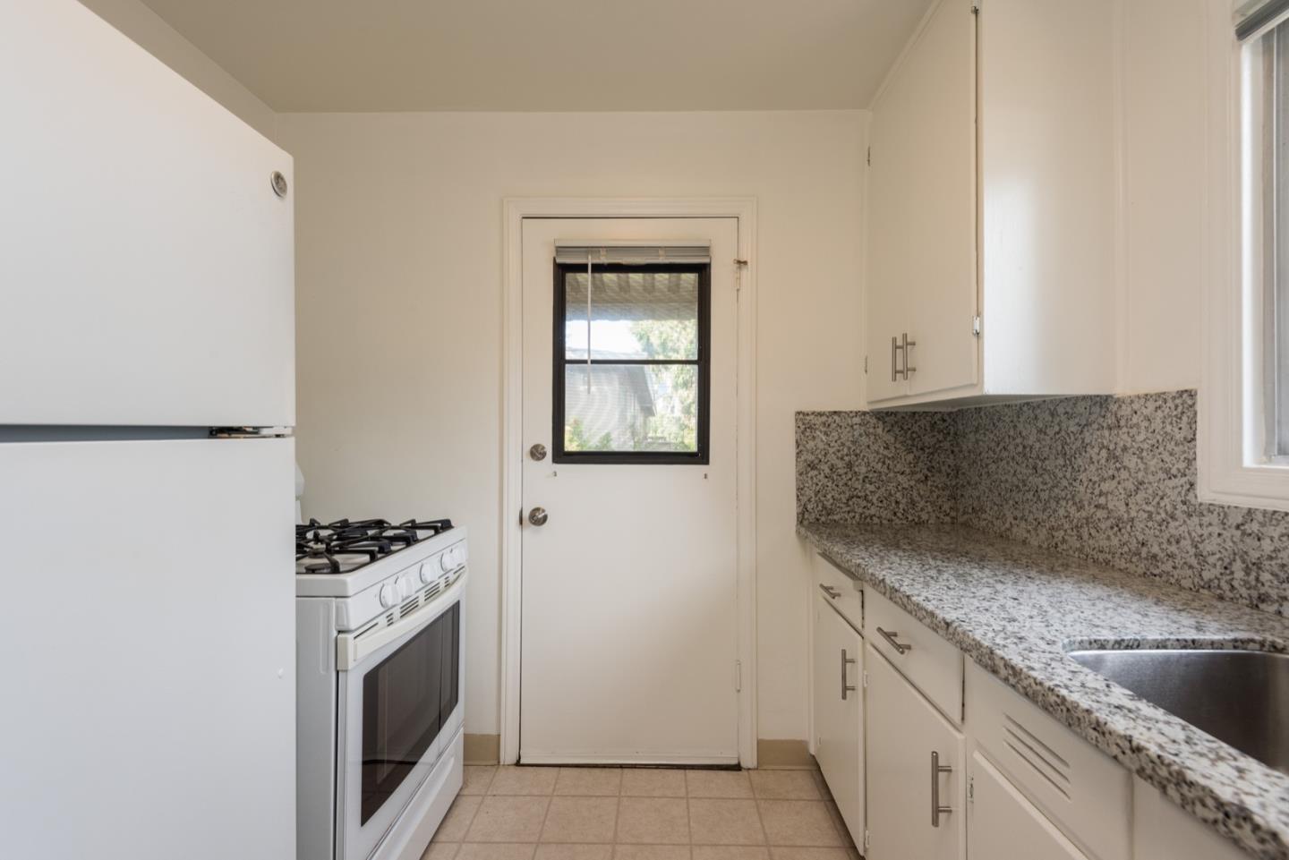 882 Middle Avenue Menlo Park, CA 94025 - Photo 10 of 22 a kitchen with granite countertop a sink and a stove