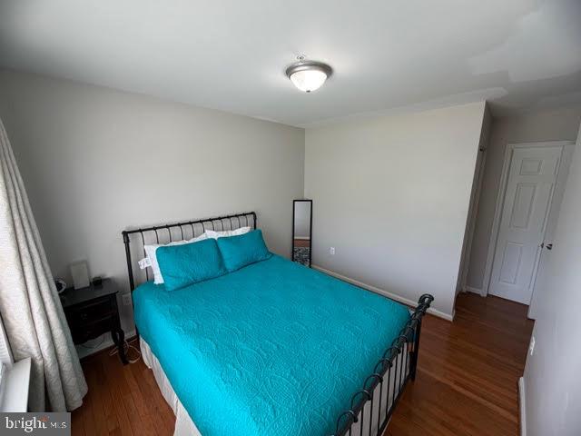 5534 Rockfish Way Clinton, MD 20735 - Photo 34 of 46 a bedroom with a bed and a dresser