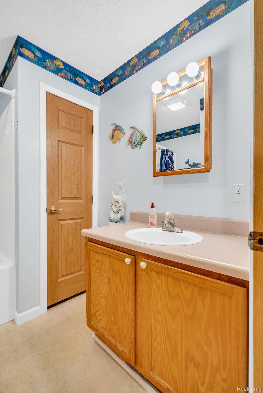 6562 Custer Road Port Sanilac, MI 48469 - Photo 34 of 56 Full bath with vanity and tub / shower combination