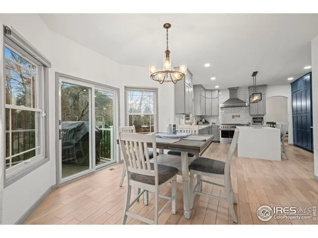 a spacious bathroom with a sink double vanity granite and a mirror