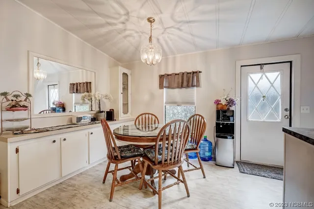a dining room with furniture and window