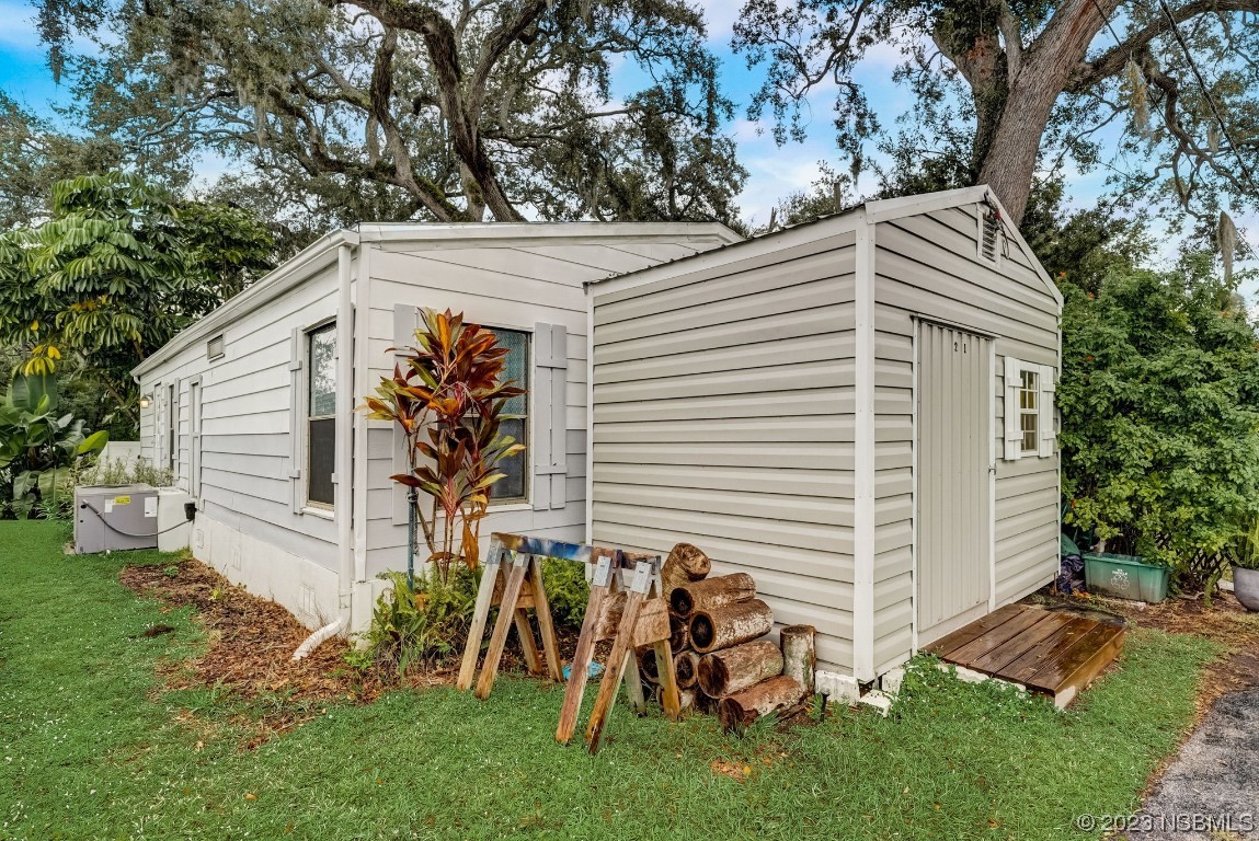 2201 South Ridgewood Avenue, Unit 21 Edgewater, FL 32141 - Photo 29 of 38 a view of house with backyard