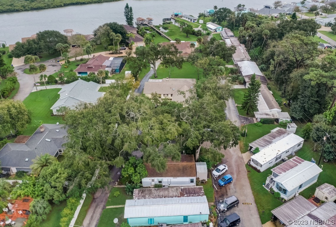 2201 South Ridgewood Avenue, Unit 21 Edgewater, FL 32141 - Photo 31 of 38 an aerial view of a house with a yard