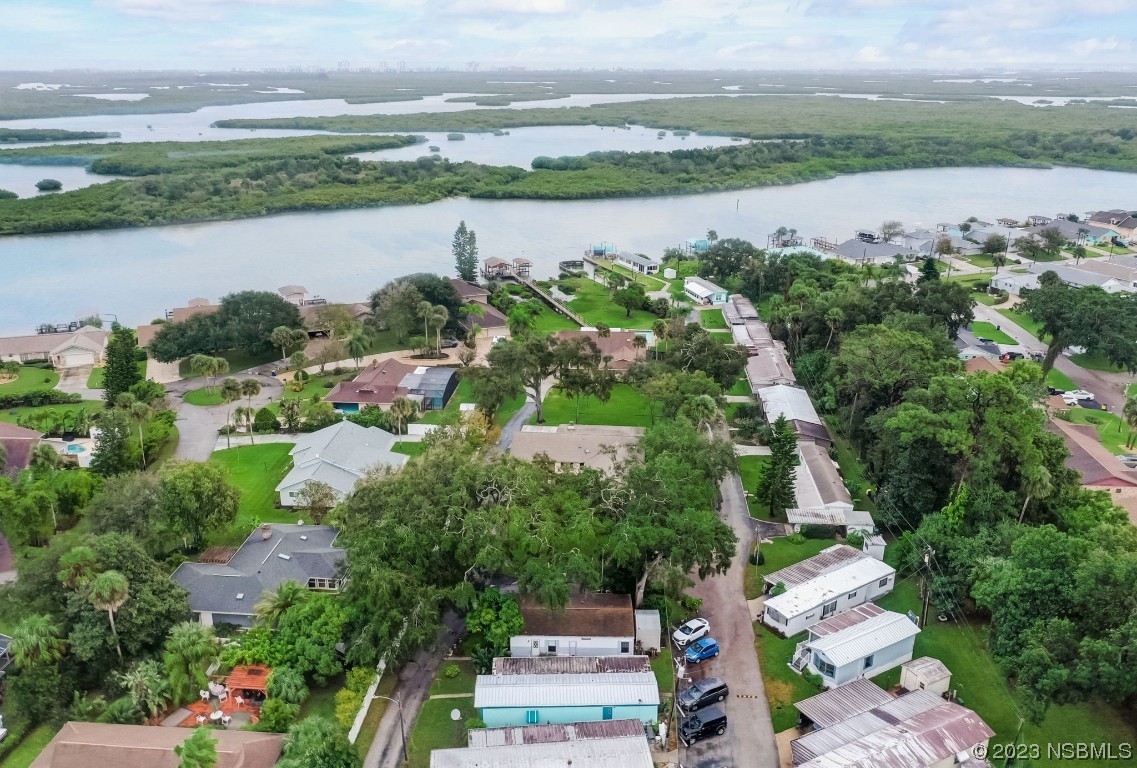 2201 South Ridgewood Avenue, Unit 21 Edgewater, FL 32141 - Photo 32 of 38 an aerial view of a city with lake view