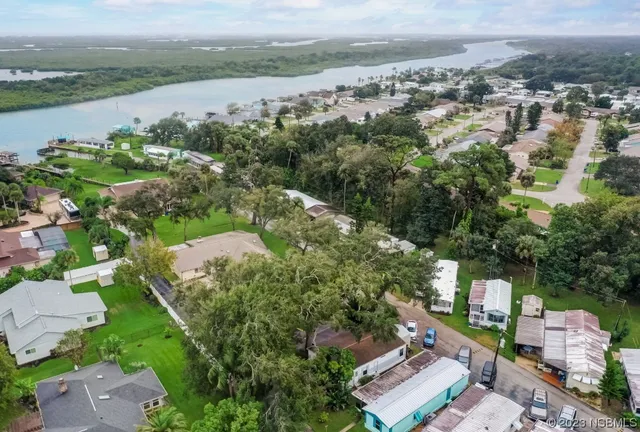 an aerial view of a city with lake view
