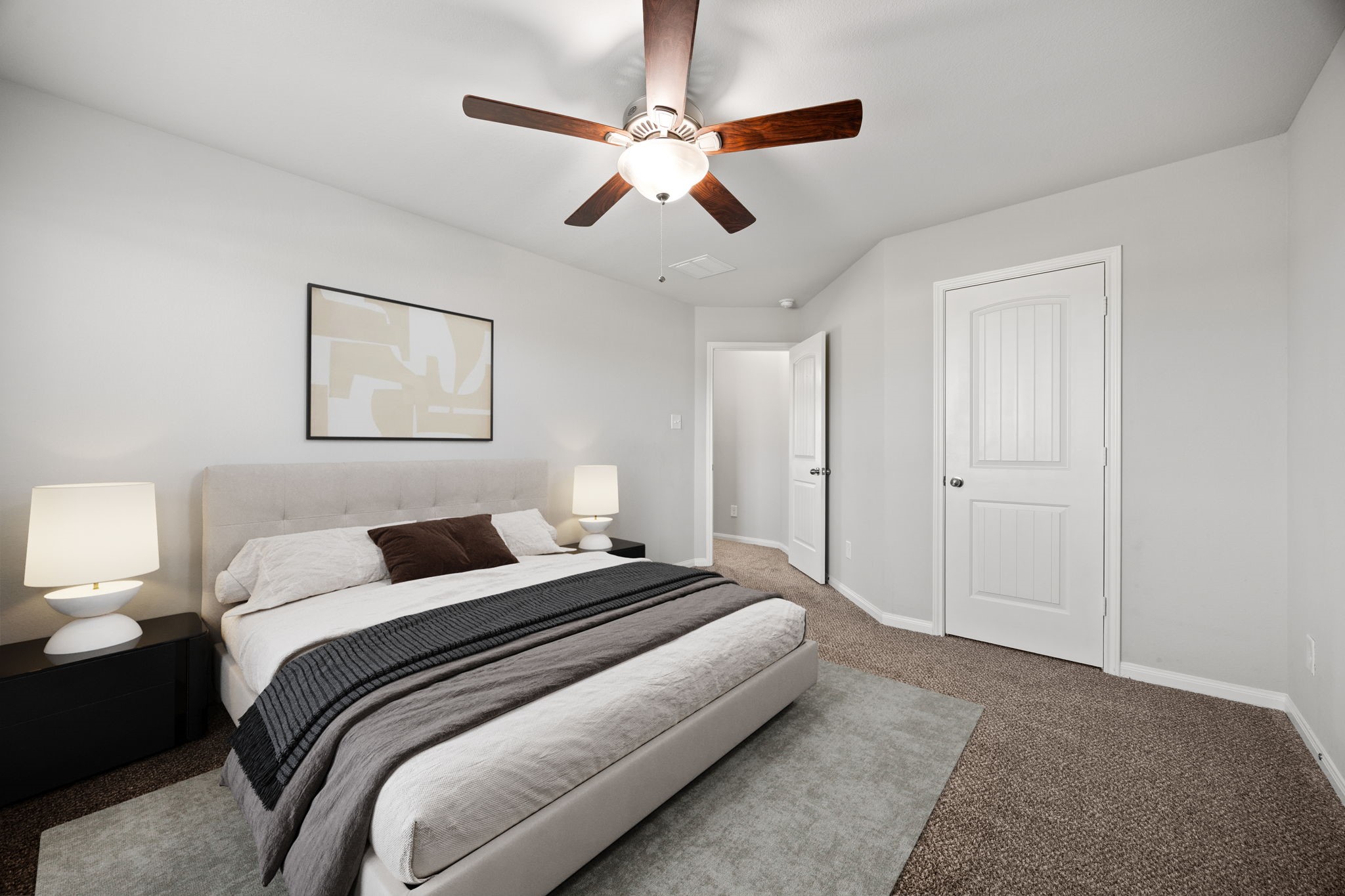 18606 Lansdowne Stream Path Katy, TX 77449 - Photo 14 of 39 a bedroom with bed and a chandelier