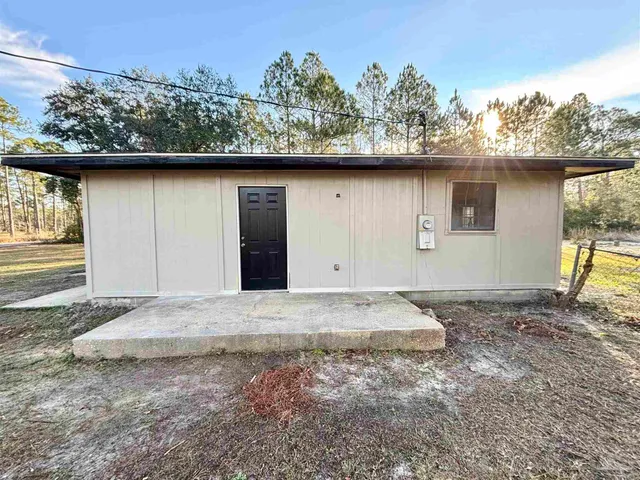 a kitchen with stainless steel appliances granite countertop a sink and dishwasher a stove top oven with wooden floor