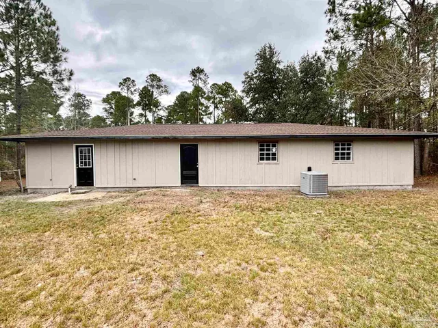 a view of a kitchen with a sink and a refrigerator