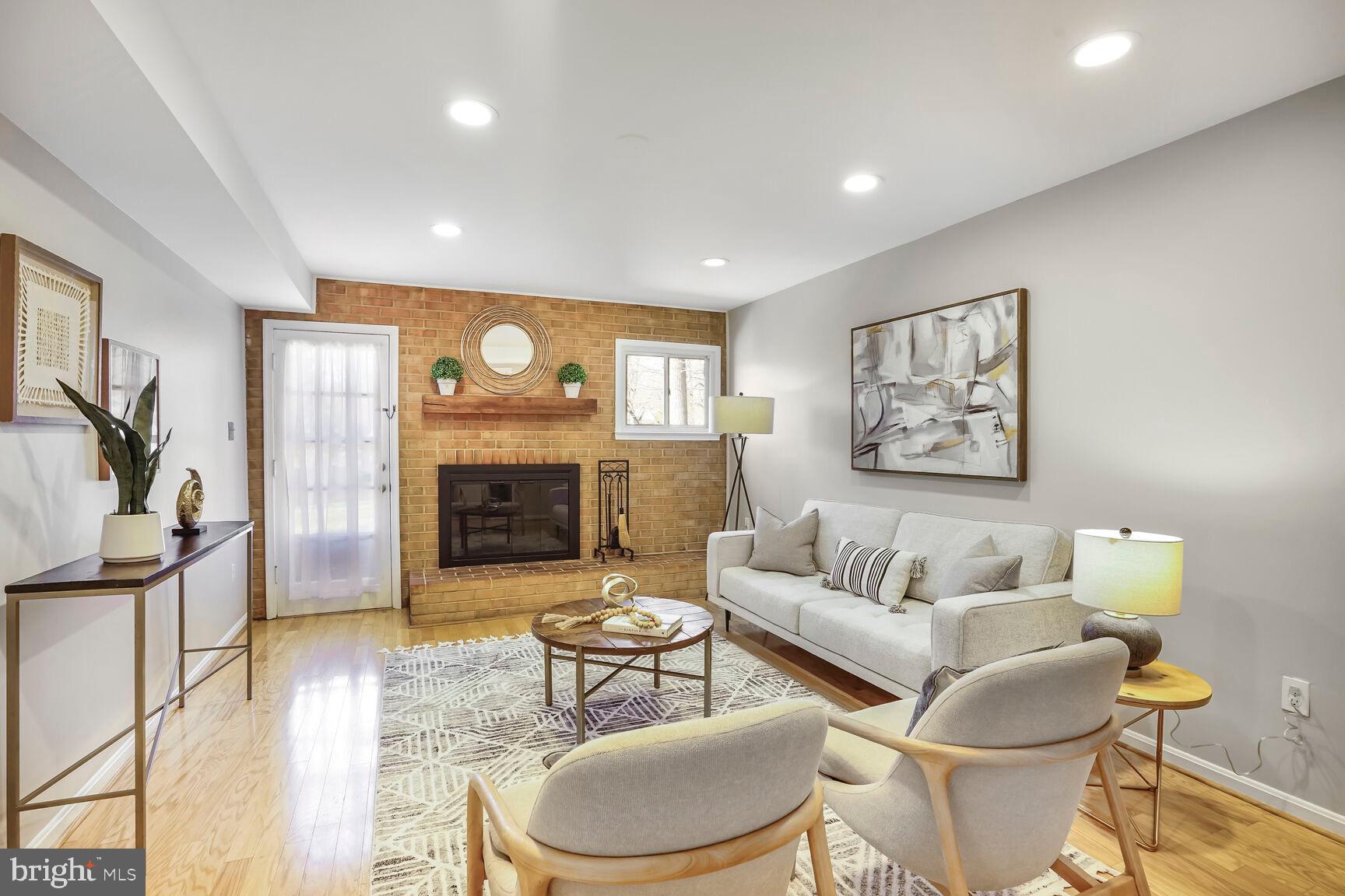 8618 Crestview Drive Fairfax, VA 22031 - Photo 18 of 33 a living room with furniture and a fireplace
