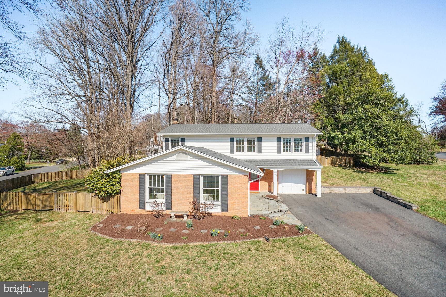 8618 Crestview Drive Fairfax, VA 22031 - Photo 2 of 33 a front view of a house with a yard