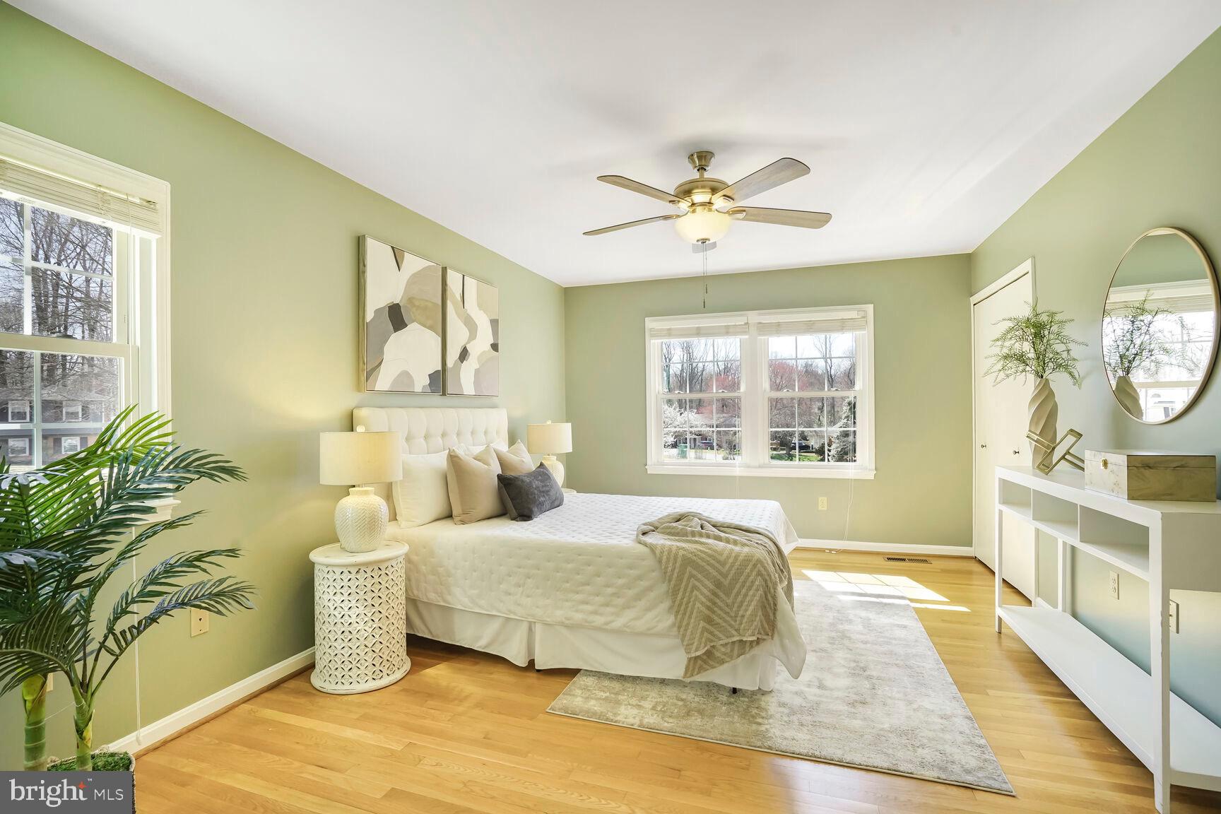 8618 Crestview Drive Fairfax, VA 22031 - Photo 23 of 33 a spacious bedroom with a large bed and a window