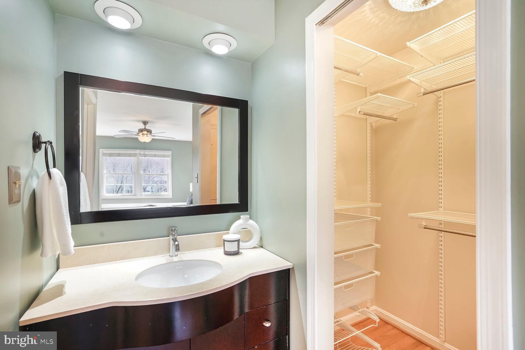 8618 Crestview Drive Fairfax, VA 22031 - Photo 25 of 33 a bathroom with a sink vanity and a mirror