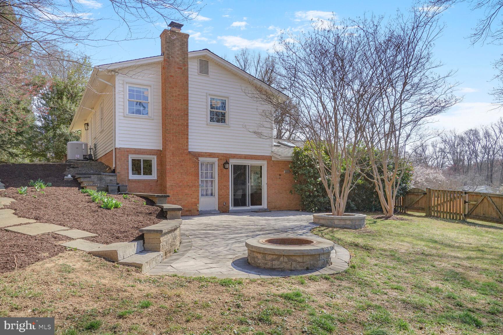 8618 Crestview Drive Fairfax, VA 22031 - Photo 32 of 33 a front view of a house with a yard and garage