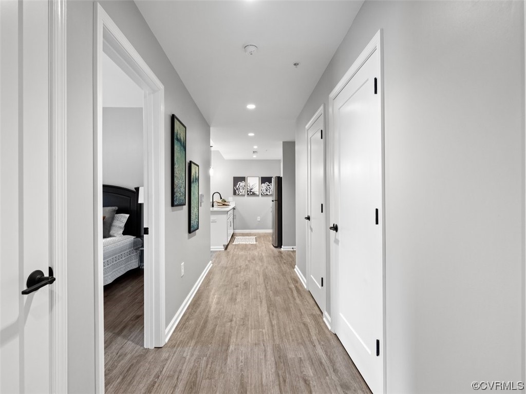 1504 Ewing Park Loop, Unit 201 Midlothian, VA 23113 - Photo 12 of 20 a view of a hallway with wooden floor and closet