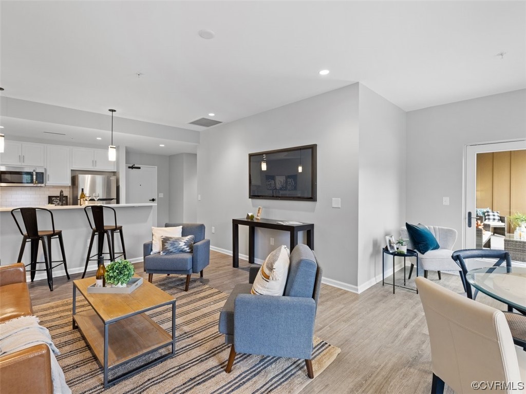 1504 Ewing Park Loop, Unit 201 Midlothian, VA 23113 - Photo 6 of 20 a living room with furniture and a wooden floor