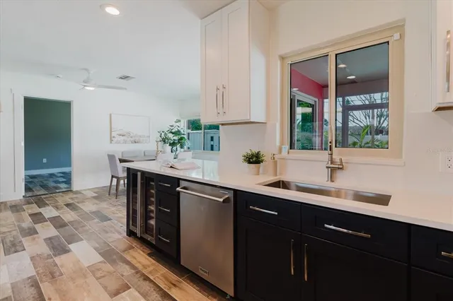 a kitchen with a sink and cabinets