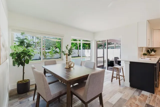 a view of a dining room with furniture and window