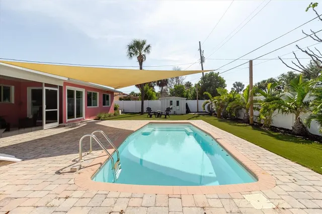 a view of a swimming pool with a lounge chairs