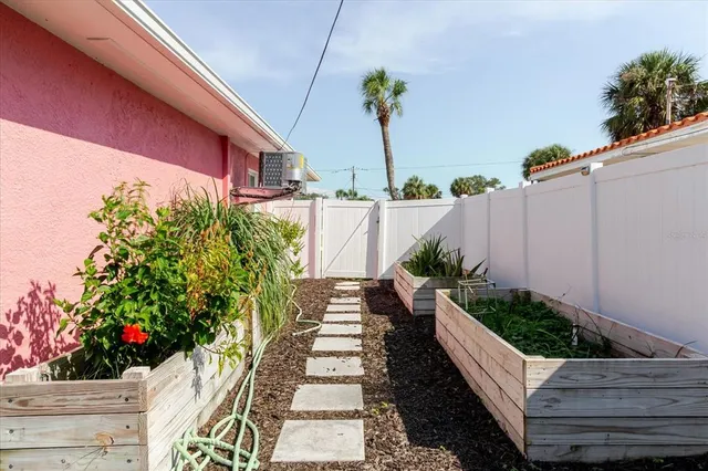 a view of a backyard with sitting area