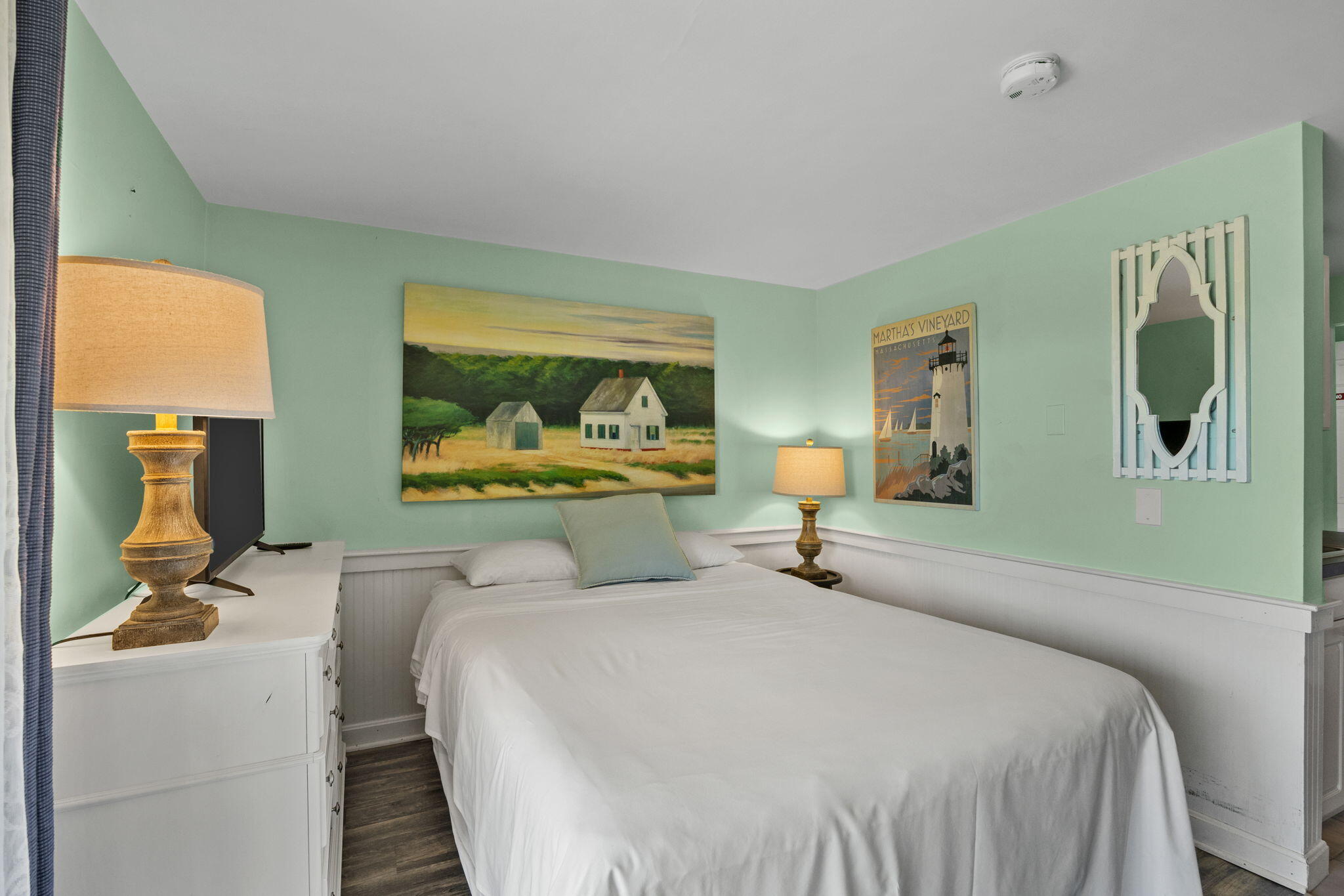 132 Shore Road, Unit 13 Truro, MA 02666 - Photo 11 of 21 a bedroom with a bed and wooden floor