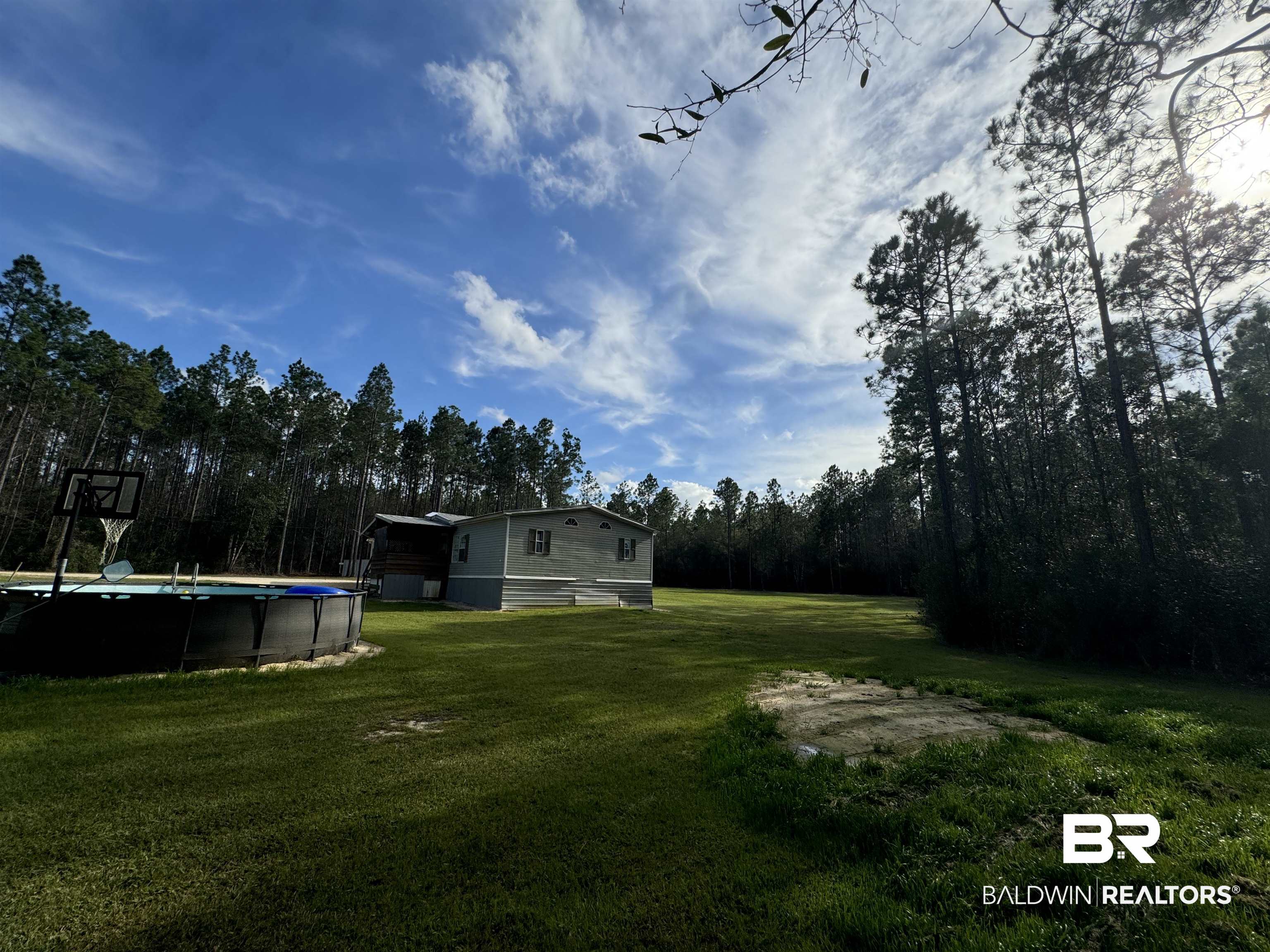 51235 Phillipsville Road Bay Minette, AL 36507 - Photo 47 of 63 View of grassy yard with an outdoor pool