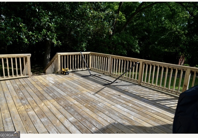 505 Ridgeland Drive Sandersville, GA 31082 - Photo 7 of 8 a view of deck and a backyard