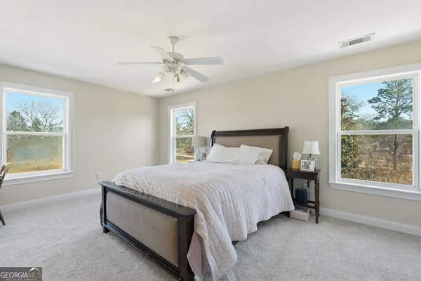 a bedroom with a bed and window