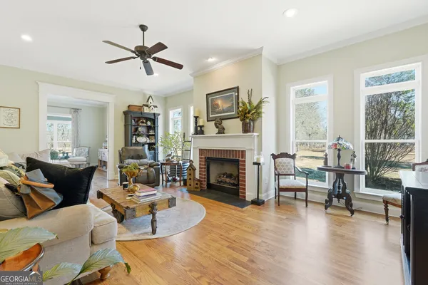 a living room with furniture and a fireplace