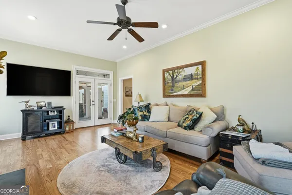 a living room with furniture and a flat screen tv