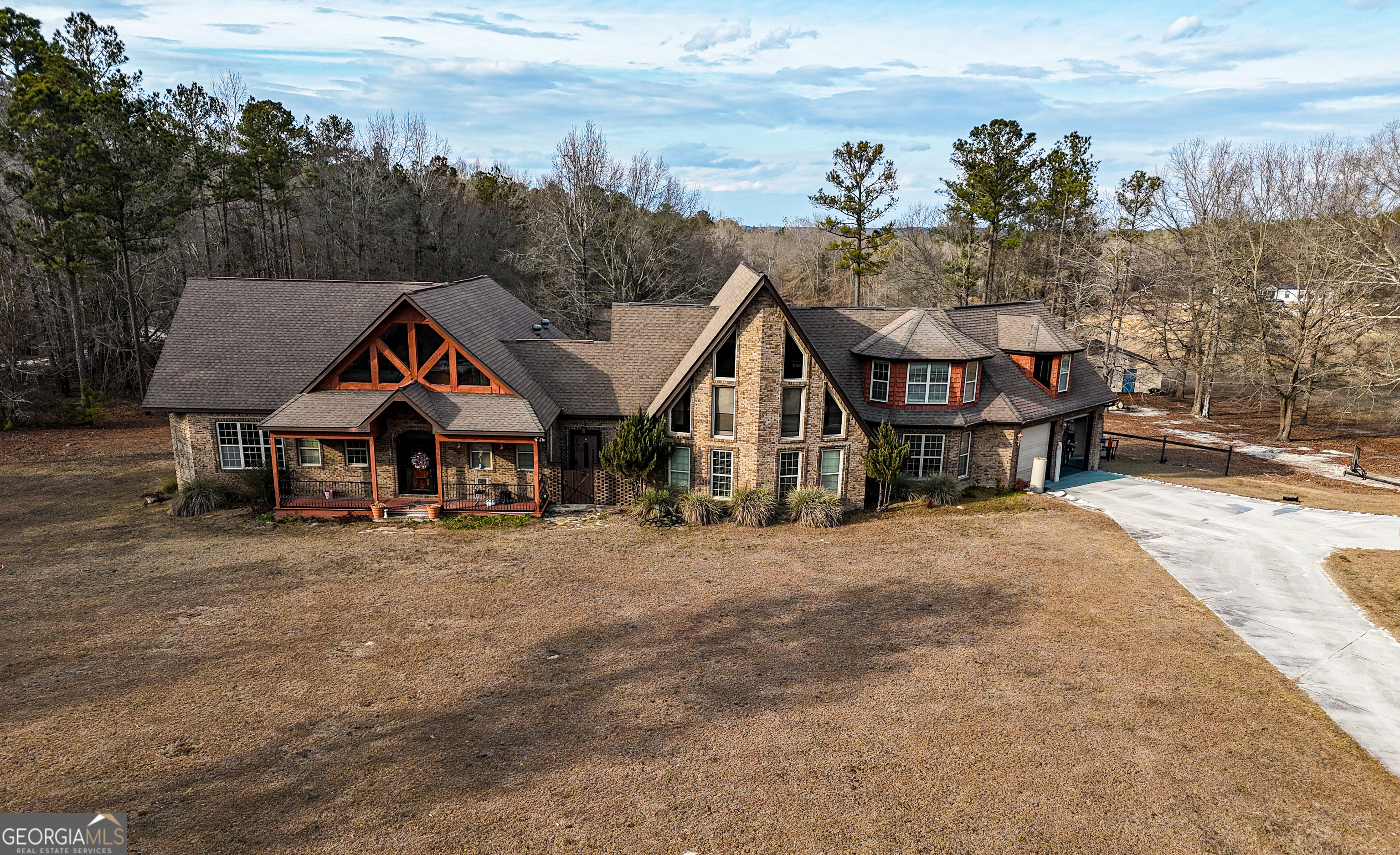 a front view of a house with trees