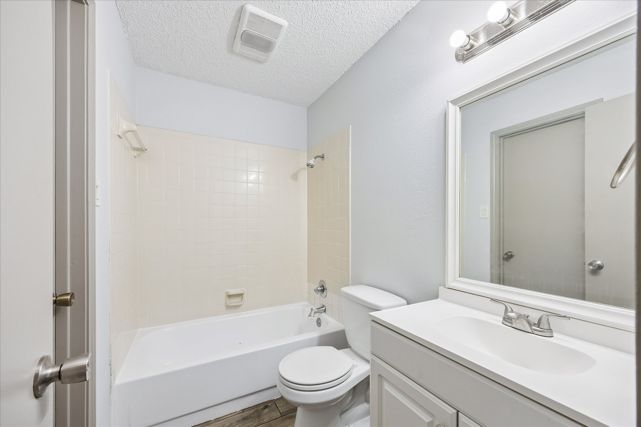 206 Lockett Street Brenham, TX 77833 - Photo 8 of 12 a bathroom with a sink a toilet a mirror and shower