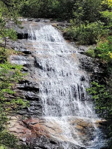 a view of a pathway with a yard
