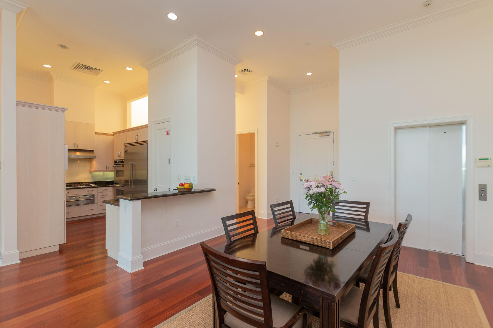 281 Trumbo Road, Unit 205 Key West, FL 33040 - Photo 13 of 35 a view of a dining room with furniture and wooden floor