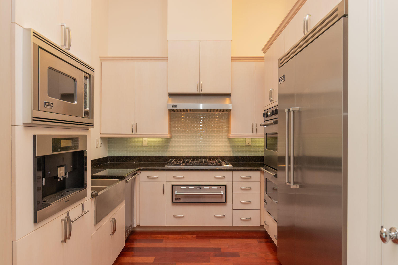 281 Trumbo Road, Unit 205 Key West, FL 33040 - Photo 14 of 35 a kitchen with stainless steel appliances granite countertop a stove and a refrigerator