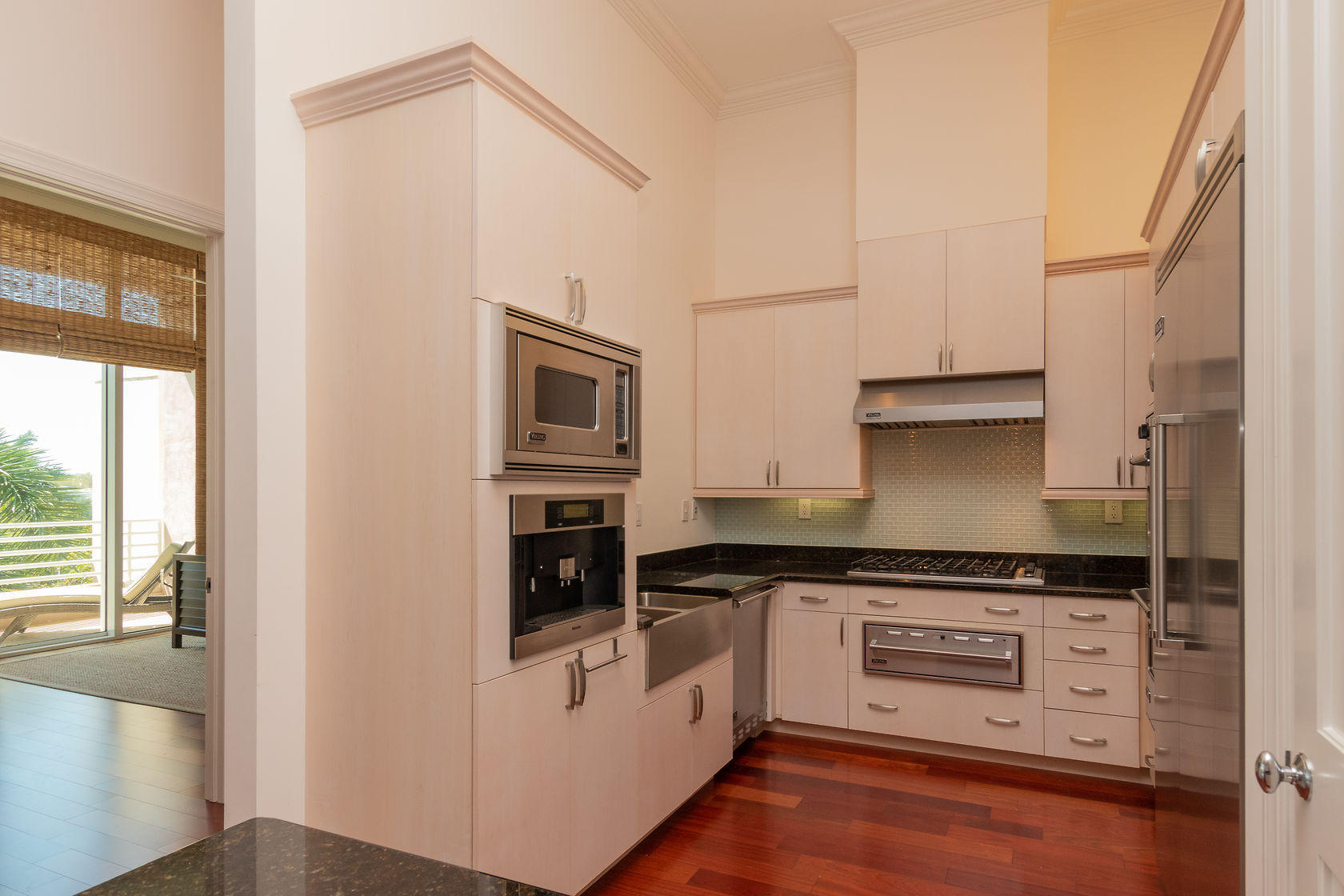 281 Trumbo Road, Unit 205 Key West, FL 33040 - Photo 15 of 35 a kitchen with stainless steel appliances granite countertop a stove and a refrigerator