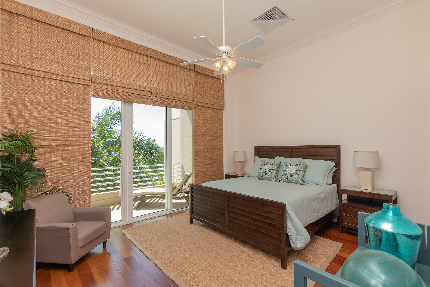 281 Trumbo Road, Unit 205 Key West, FL 33040 - Photo 16 of 35 a bedroom with a bed wooden floor and a large window